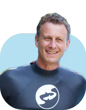 Eduardo Ferré, Swimming Nature’s Founder & CEO, smiling in a branded Swimming Nature swimsuit.