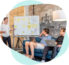 Group of instructor trainees seated in a classroom during a training session.